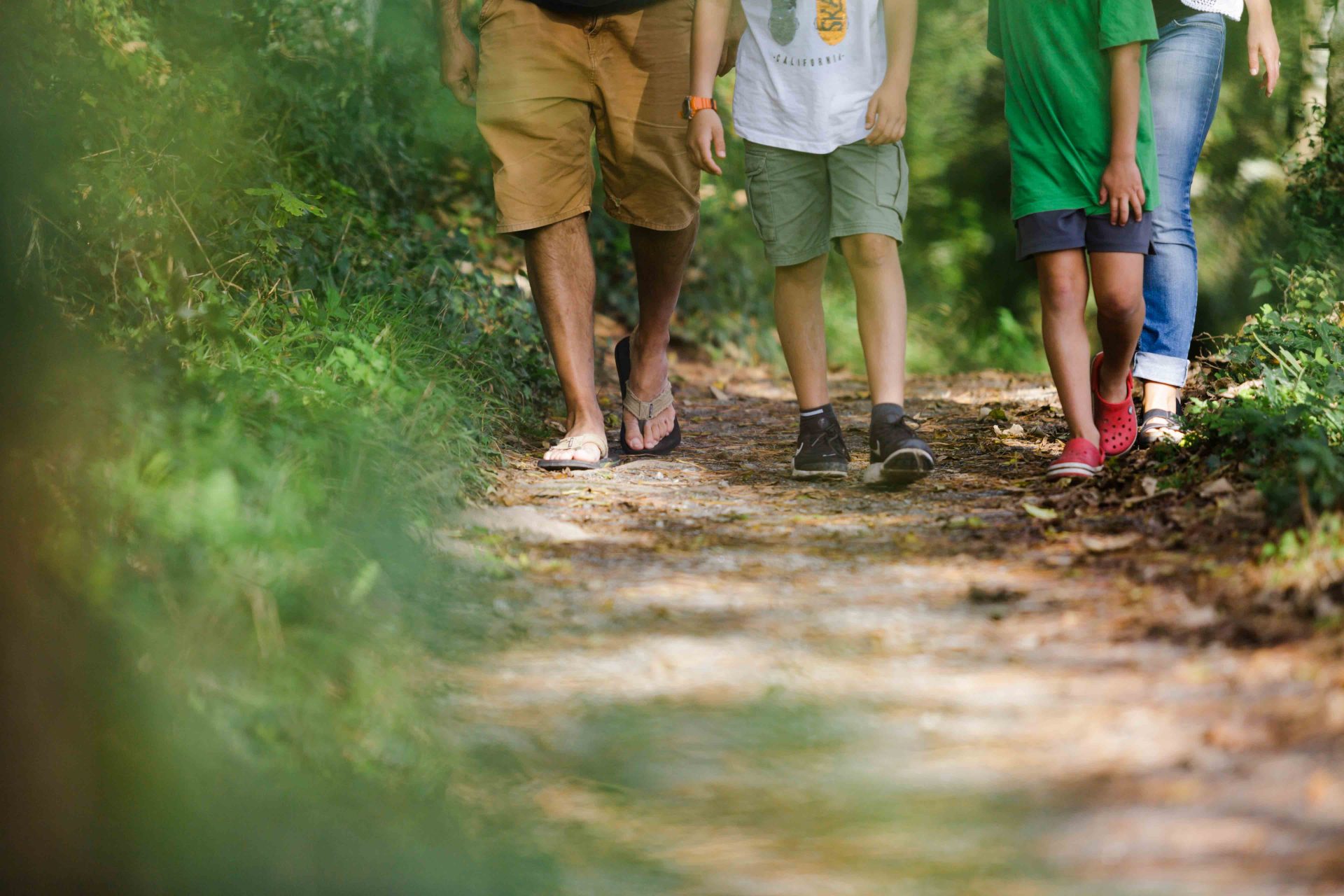 Family walking while on holiday in Cornwall