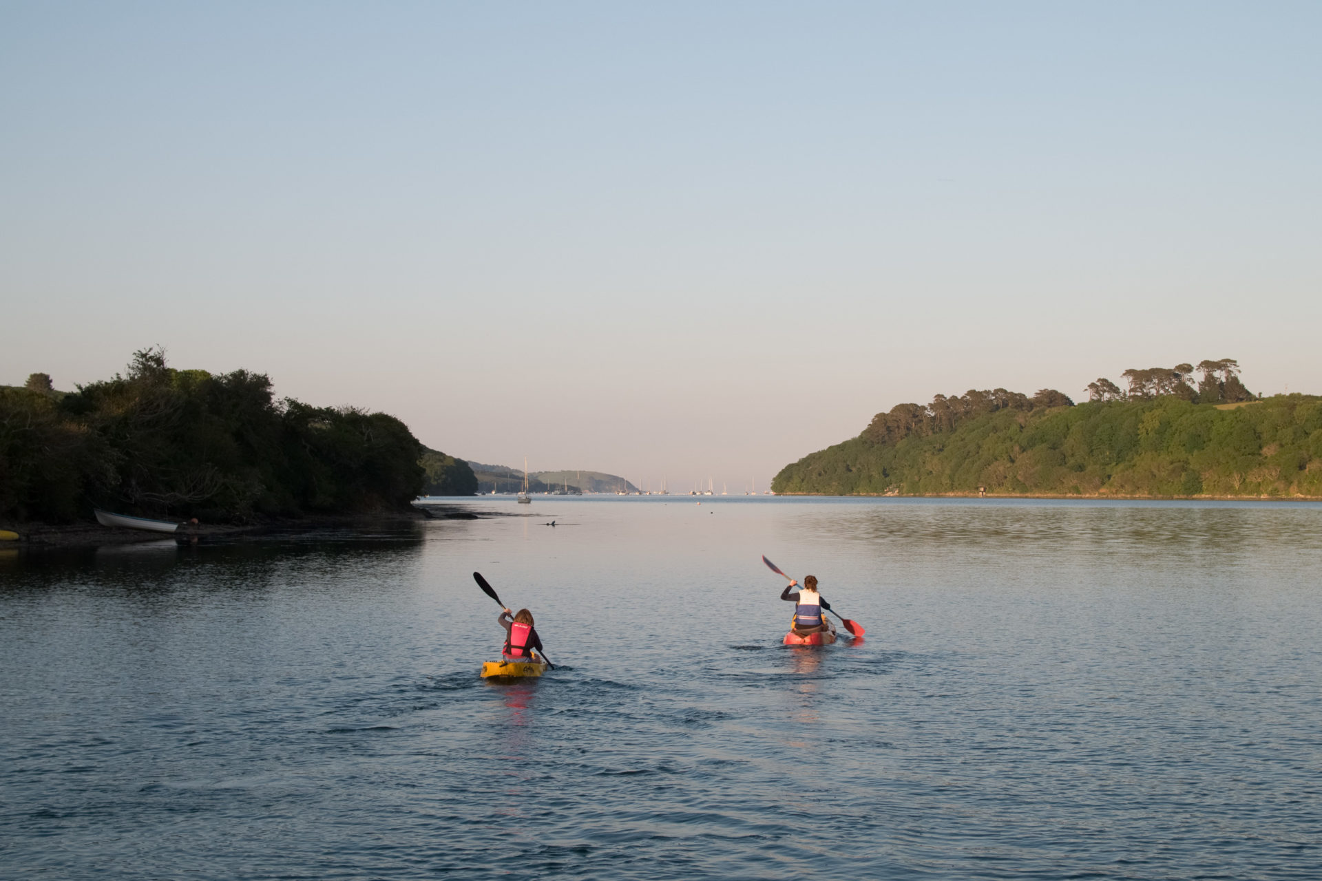 Kayaking family on the Helford River at Sunset